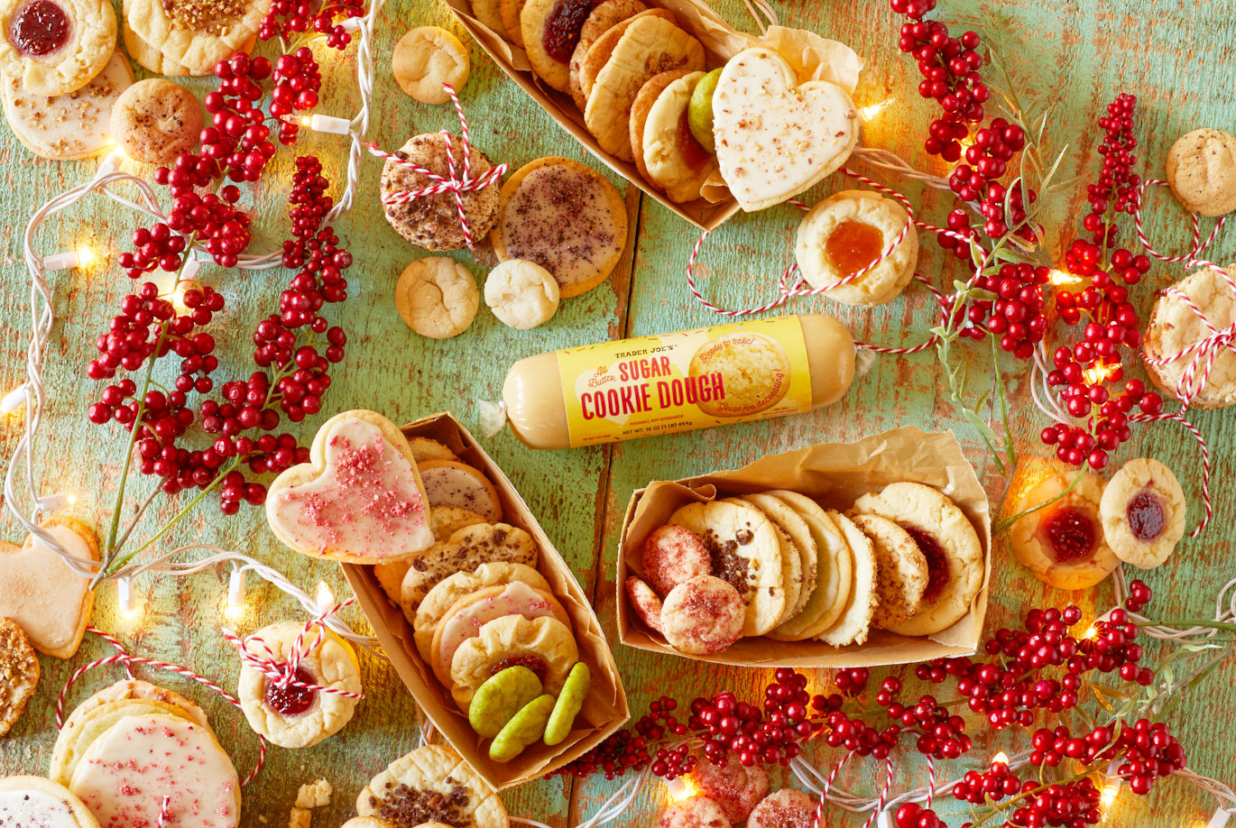 Trader Joe's All Butter Sugar Cookie Dough; prepared as several different kinds of cookies, surrounded by festive berries, string light and ribbon